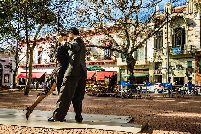 Two unidentified tango dancers performing at Plaza Serrano in San Telmo neighborhood in Buenos Aires