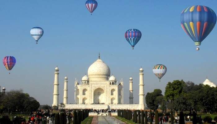 Hot air balloons flying over Taj Mahal during the Taj Balloon Festival