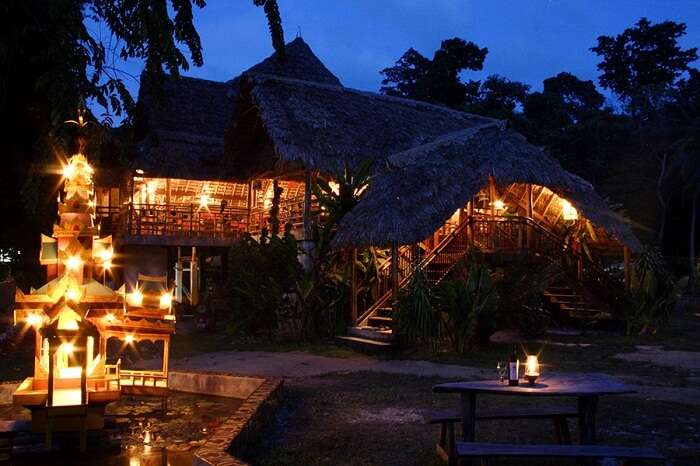 The well-lit cottages in the Wild Orchid Resort in Andaman on an evening