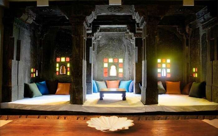 Sitout area decorated with colorful glass windows in Madri Haveli in Udaipur