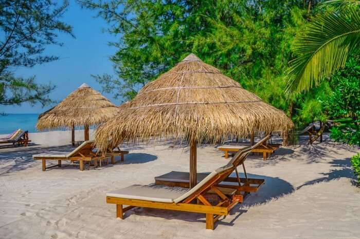 Sunbed and umbrella by the Otres beach in Sihanoukville