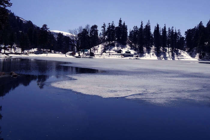 The partial frozen Dodital lake on a bright day