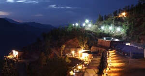 A night shot of the Whispering Pines camping resort in Dhanaulti