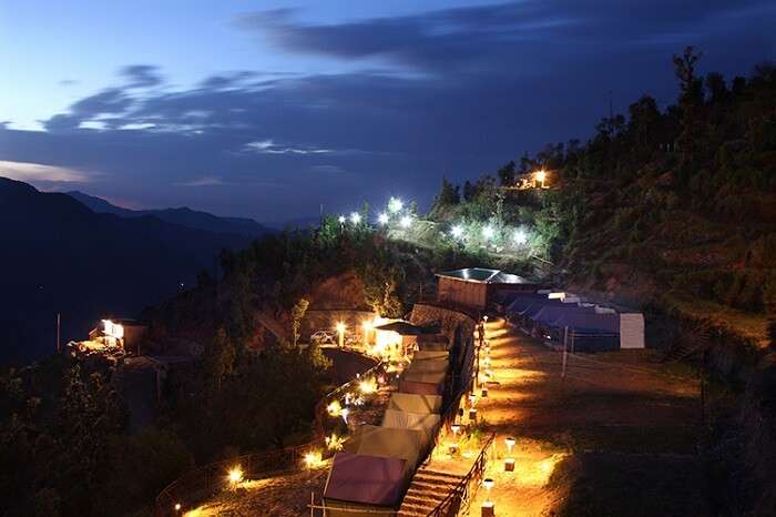 A night shot of the Whispering Pines camping resort in Dhanaulti