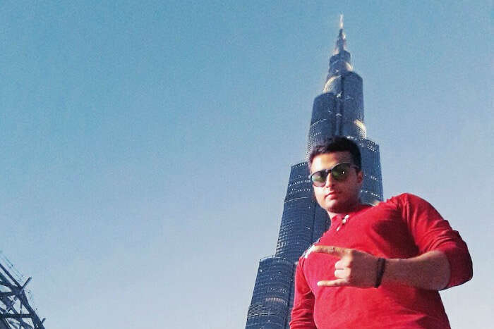 abhinav standing below the Burj Khalifa