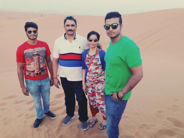 a family picture on the sands of dubai