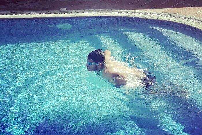 taking a swim in the hotel pool