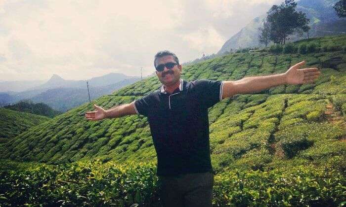 Standing before the tea plantations