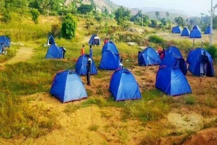 Large number of camps tented in an open ground at Bananthi Betta