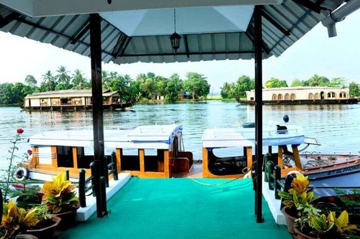Houseboats at the banks of the Riverine Resort in Alleppey