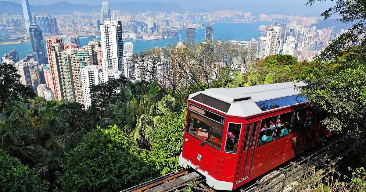 Tourists riding the famous Victoria Tram in Hong Kong
