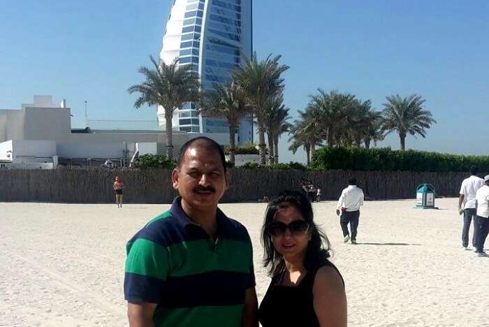 A couple standing in front of Burj Al Arab Dubai