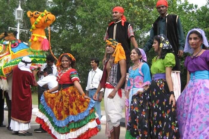 Locals dressed in colorful clothes taking part in the Cochin Festival