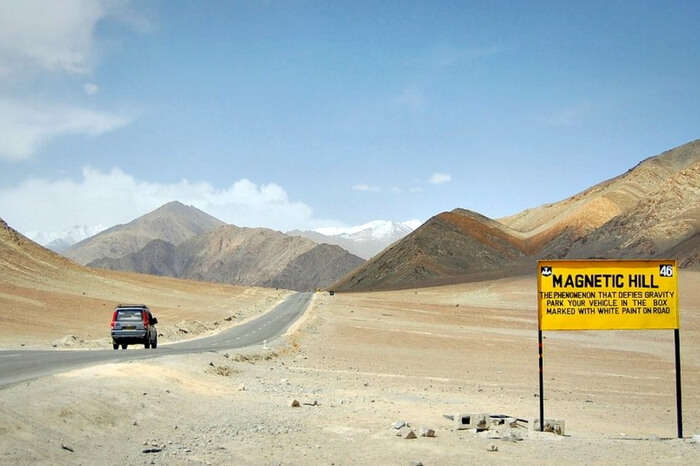 Tourists traveling in a vehicle on the Leh Kargil Highway