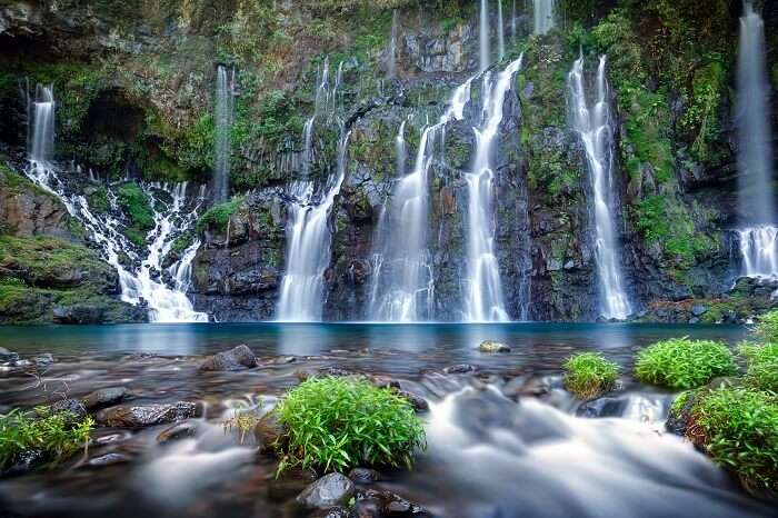 Panoramic view of waterfall on river Langevin in tropical jungle of Reunion Island