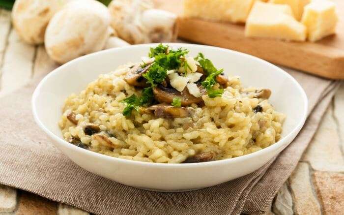 Risotto served in a white bowl