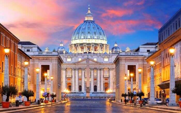 St Peter’s Basilica lit up during evening in Rome