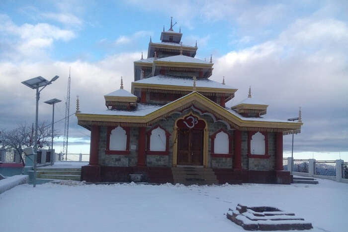 A snap of the snow-covered Surkanda Devi Temple in Kanatal during winters