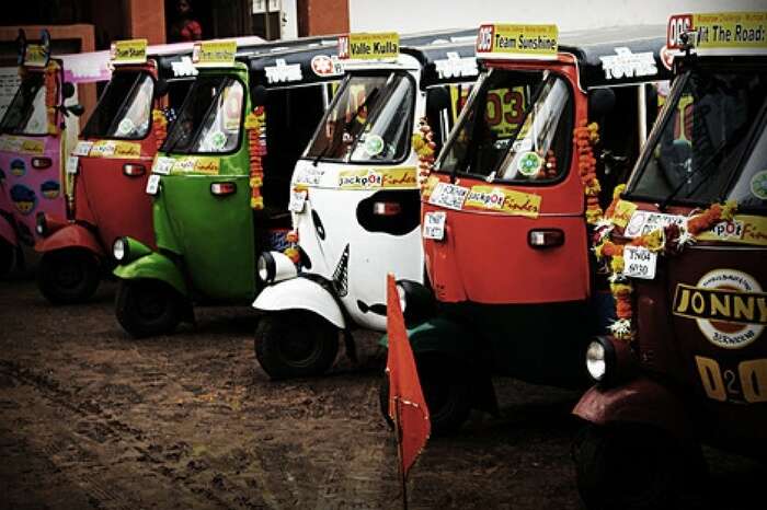 Auto rickshaws parked in a still form the documentary Hit the Road: India