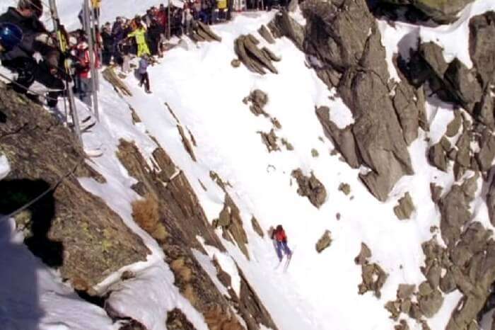 Mountaineer scaling the mountain in a still from the documentary The Edge of Never