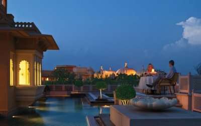 A couple enjoying their dinner date in Udaipur Udaivilas Resort which is among the most romantic resorts in India