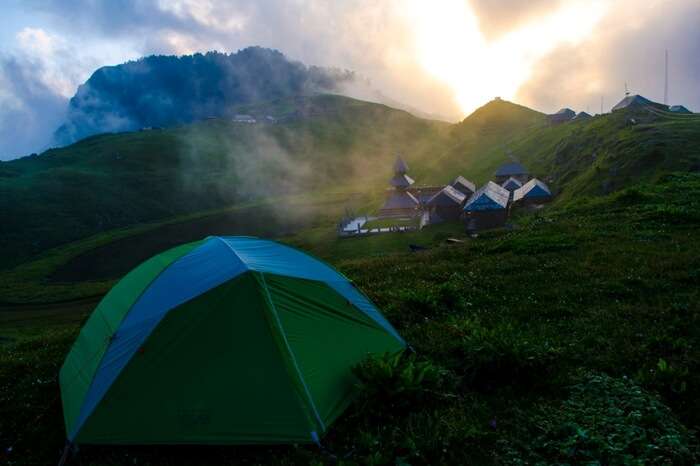 A quiet and picturesque campsite near Prashar Lake in Himachal