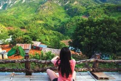 A girl relaxes and enjoys the beautiful views at one of the weekend getaways from Delhi