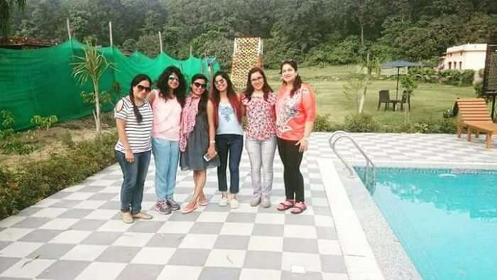 me and the girls posing beside the massive pool