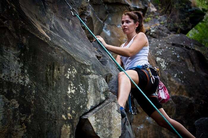 A woman tries rock climbing