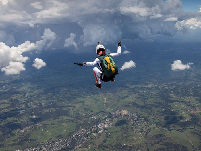 A woman skydiving that is one of the adventurous things to do in Australia