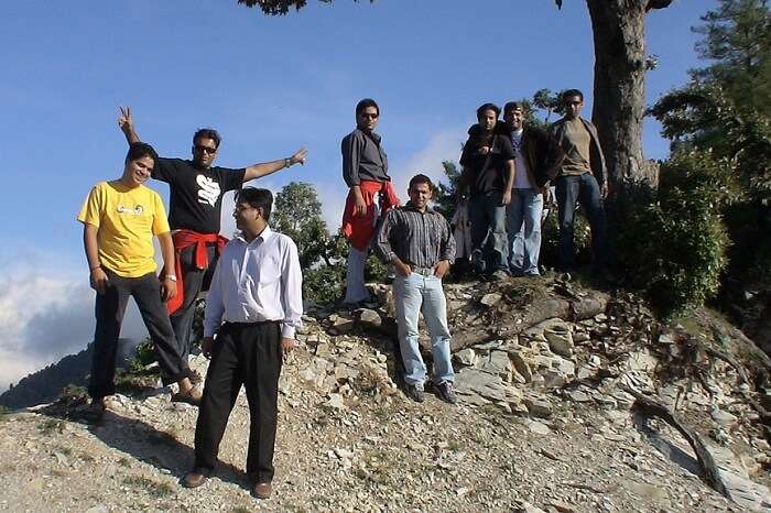 A group of trekkers taking a break while trekking in Kanatal