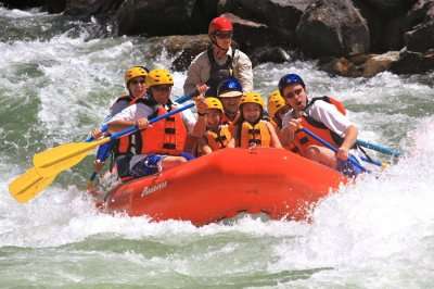 A group of foreigners indulge in white water rafting in Goa