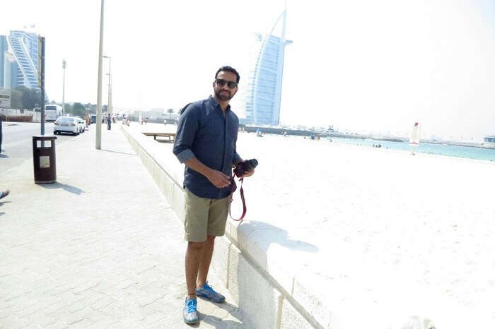 Man posing near burj-al-arab in Dubai