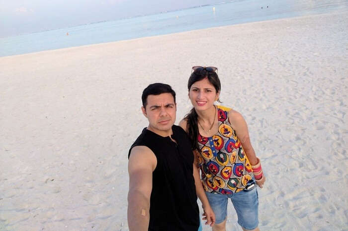Couple on white sandy beach