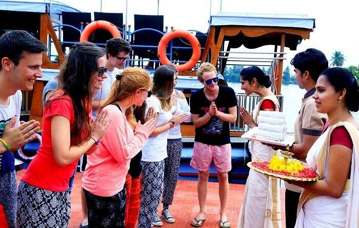 Indian women welcome travelers on arrival