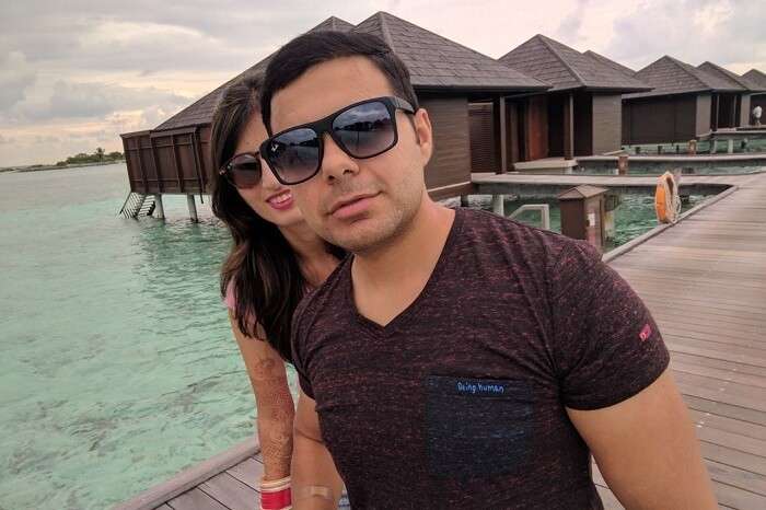 couple enjoying near water villas