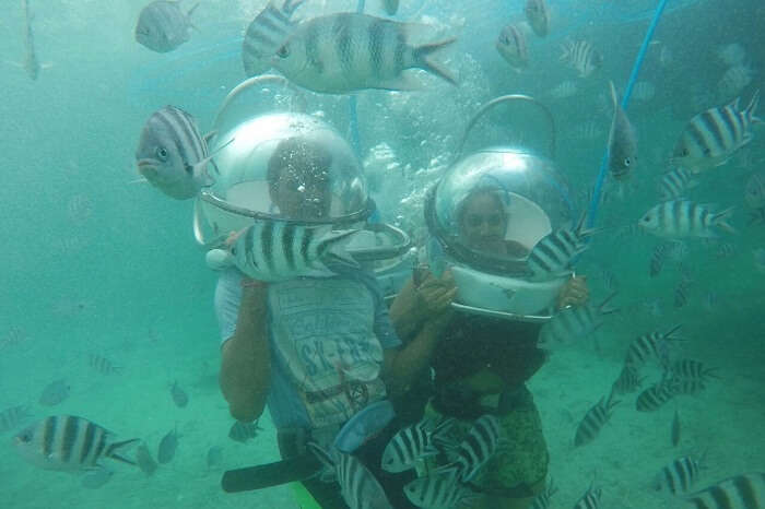 Couple enjoying underwater seawalking