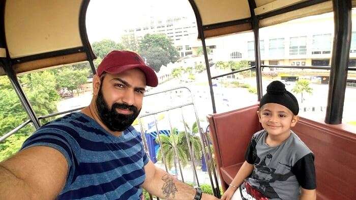 Riding the cable car with his son