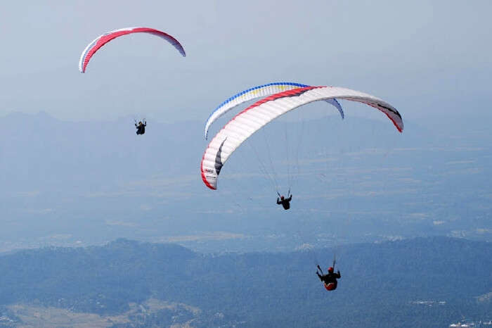 Paraglider enjoying paragliding in Khajjiar