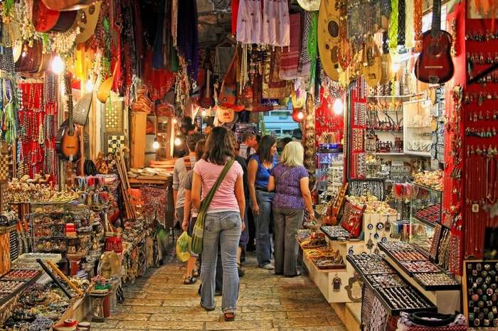 Travelers exploring the souvenirs shop at a tourist spot