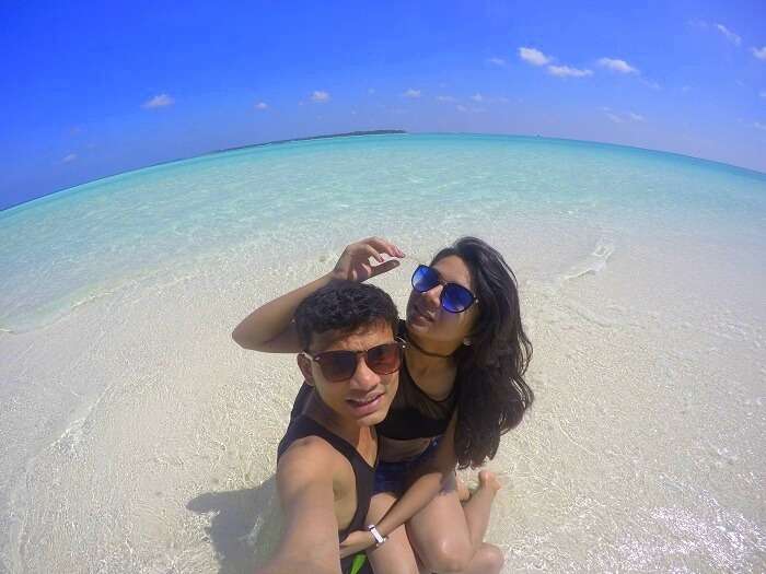 Nisarg and his wife chilling on a beach in Maldives