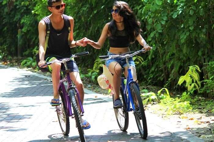 Nisarg and his wife cycling at the Sun Island Resort in Maldives