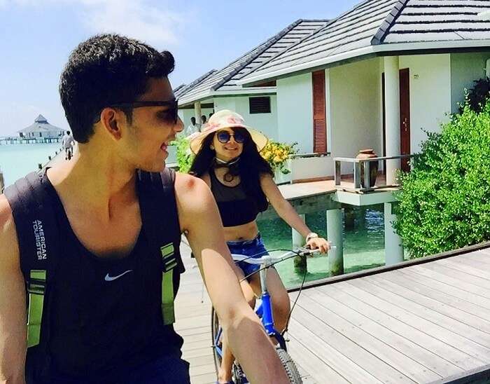 Nisarg and his wife having a good time cycling at their resort in Maldives