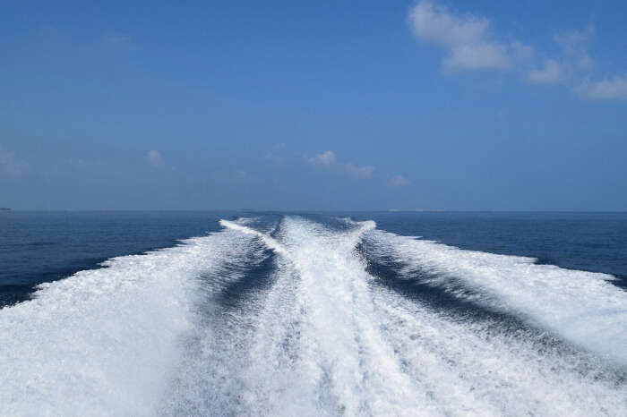 kishor & wife sailing away in a speed boat