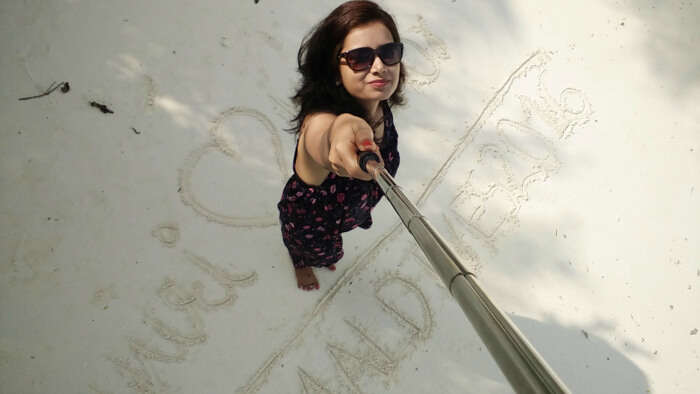 kishor's wife taking a selfie on the beach