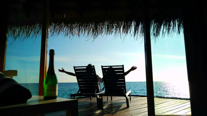 kishor & wife chilling in their water bungalow in maldives