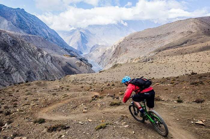A tourist goes for mountain biking in Nepal