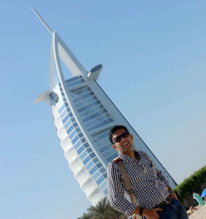 Standing surpassing the grand Burj Al Arab hotel in Dubai