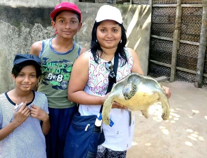 Family in turtle hatchery