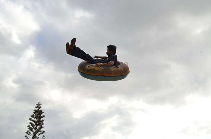 Man enjoying a flying tube ride in Mauritius